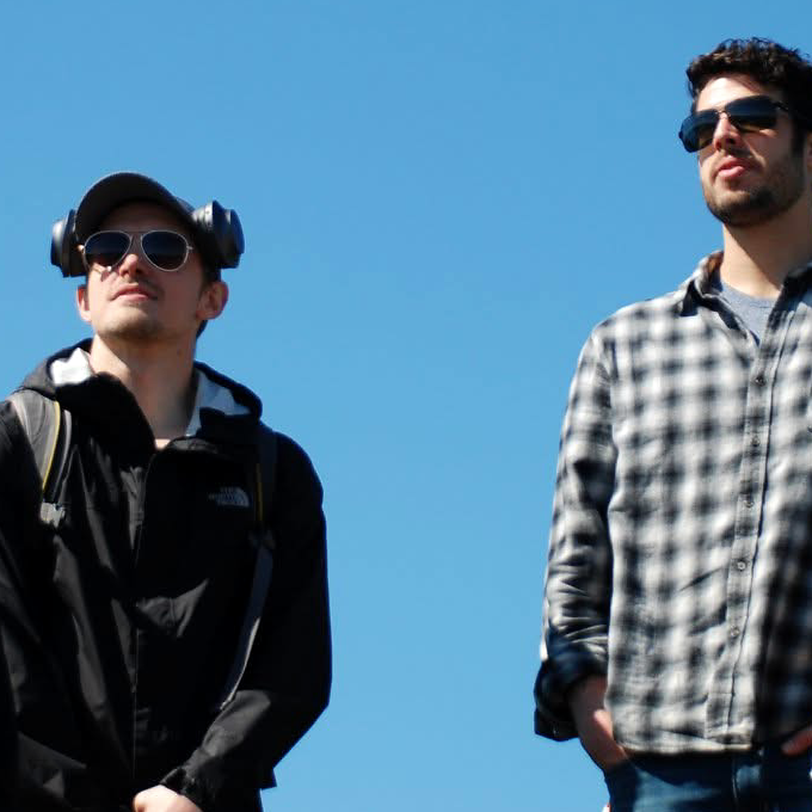 Wesley Beckner and Wesley Tatum standing beneath a blue sky