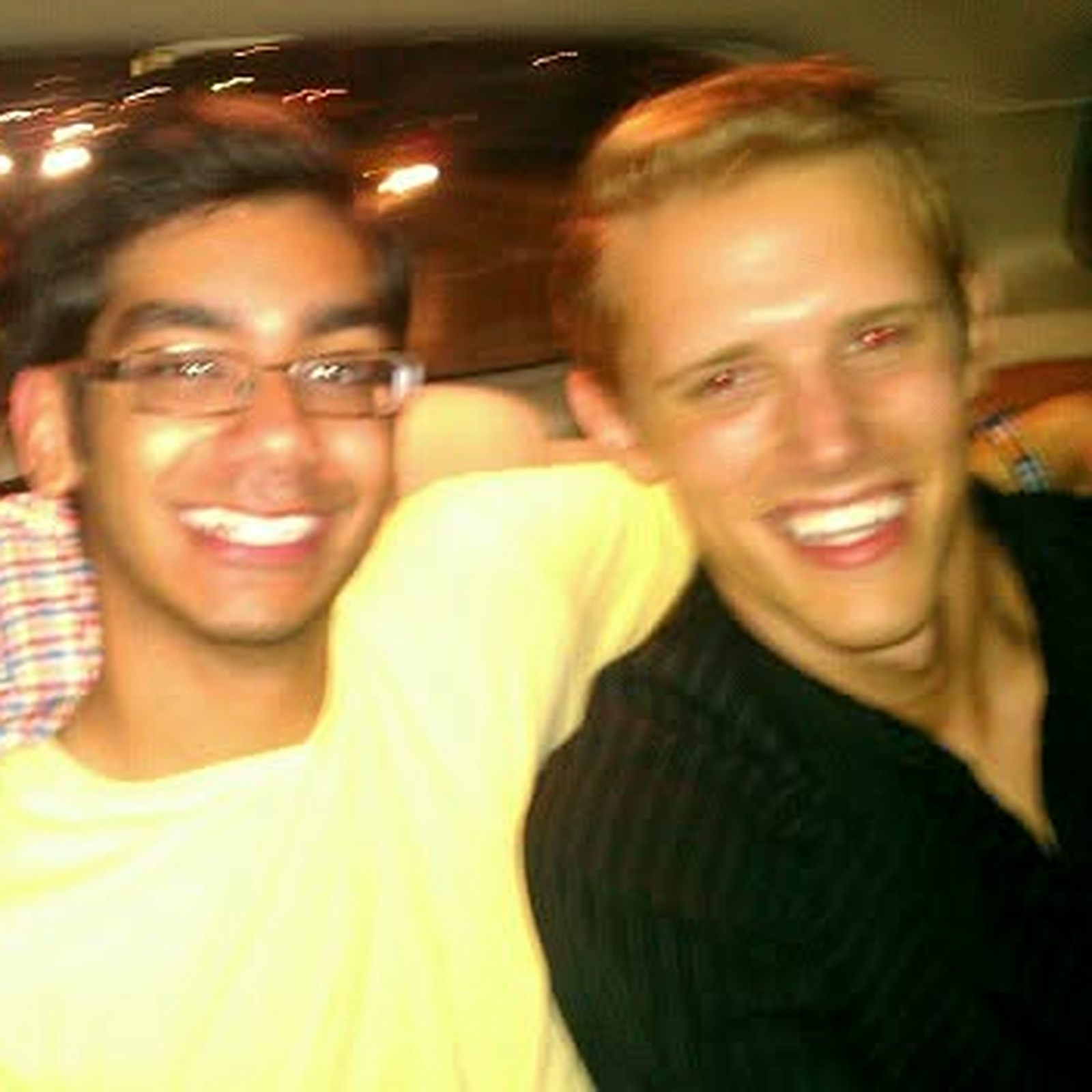 Neel Shah and Wesley Beckner smiling together at a party